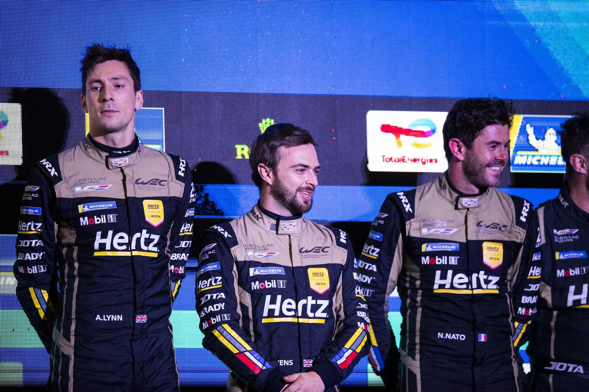 Alex Lynn, Will Stevens, Norman Nato on the Interlagos podium following their WEC win.