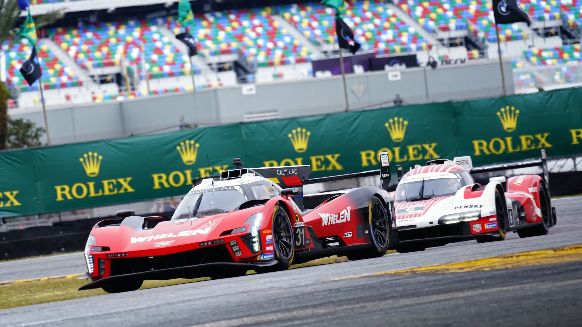 Cadillac and Porsche GTP cars at Daytona International Speedway, on the infield.