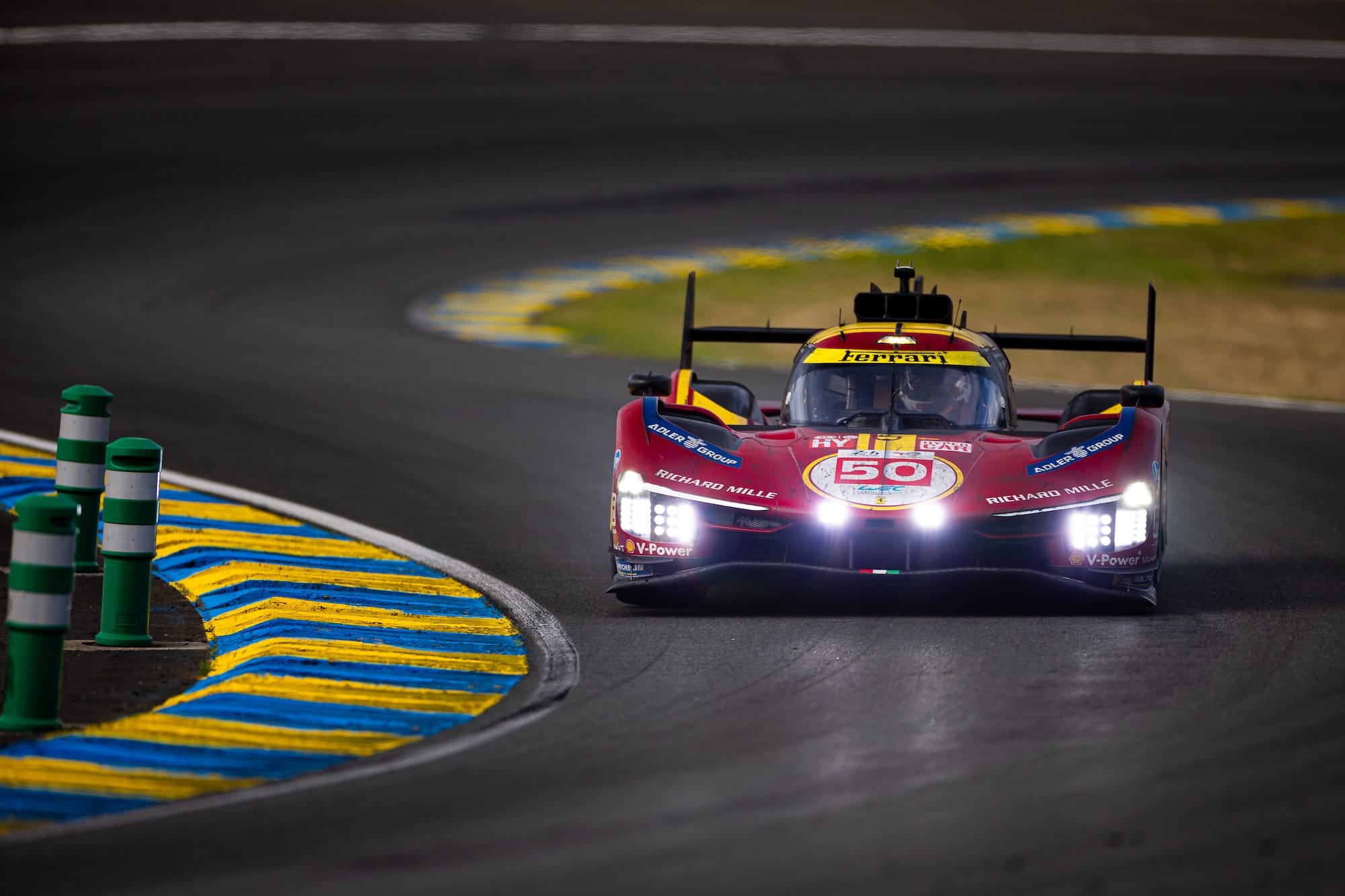 The #50 Ferrari at Forest Esses at Le Mans 2025, in fading daylight
