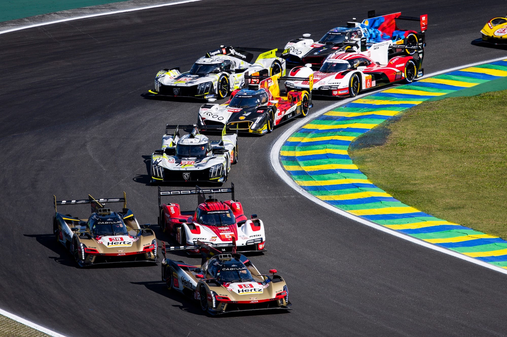 Start of the 6 Hours of Sao Paulo 2025, with Will Stevens leading in the #12 Cadillac over Julien Andlauer in the #5 Porsche and Earl Bamber in the #38 Cadillac